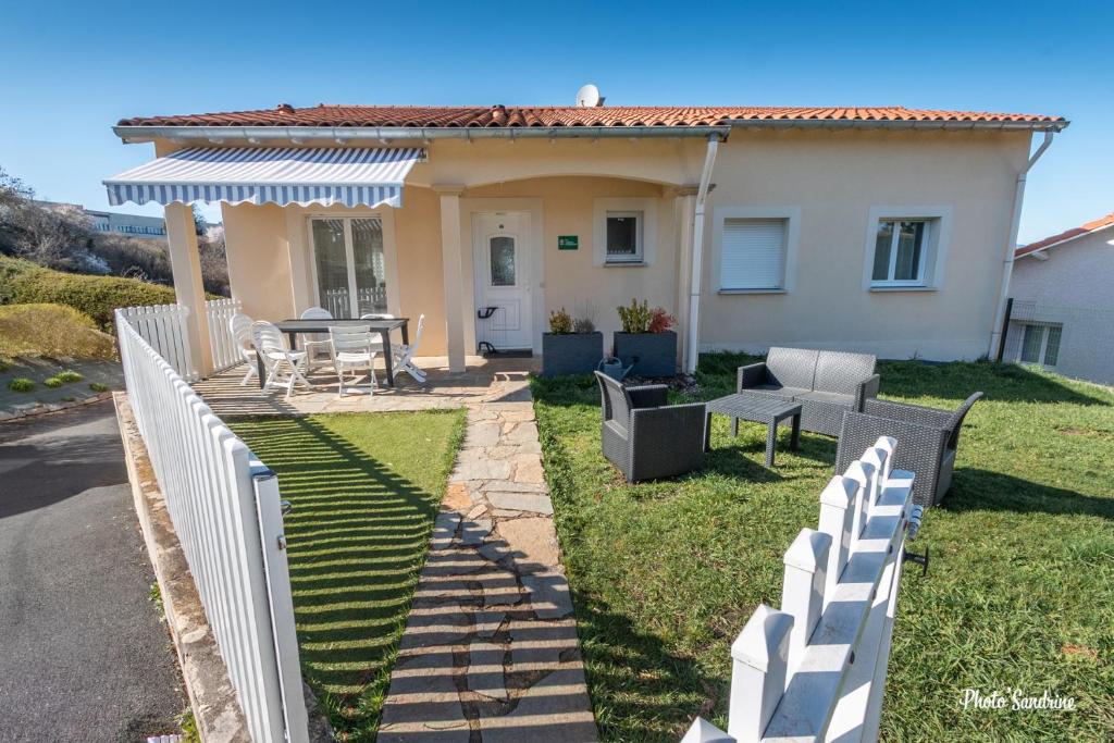 a white fence in front of a house at Le balcon de Compostelle in Espaly-Saint-Marcel