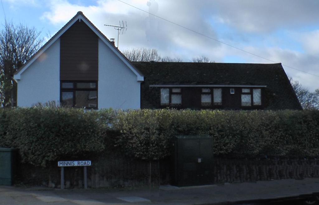 a house with a street sign in front of it at Bay Lodge in Birchington