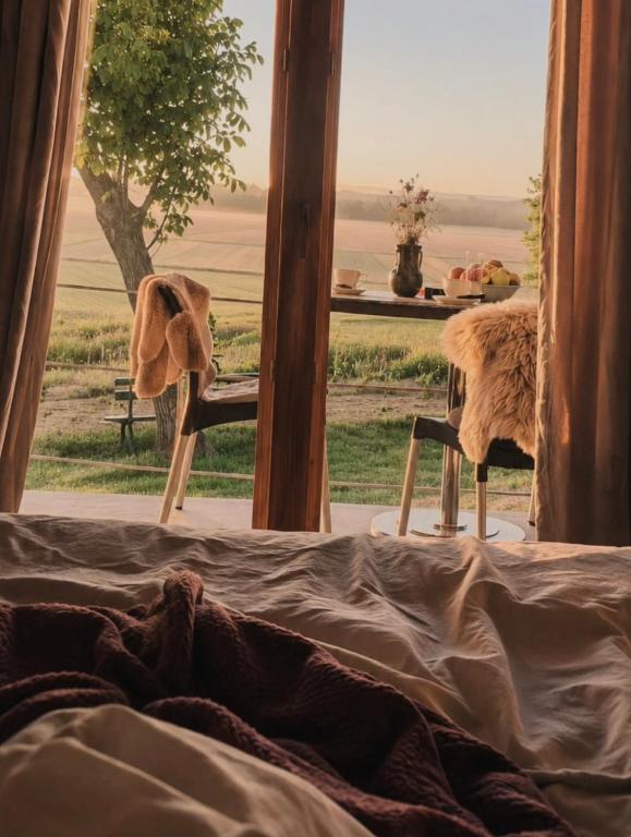 a room with a bed with a view of the ocean at Casa33 in Dobrovnik