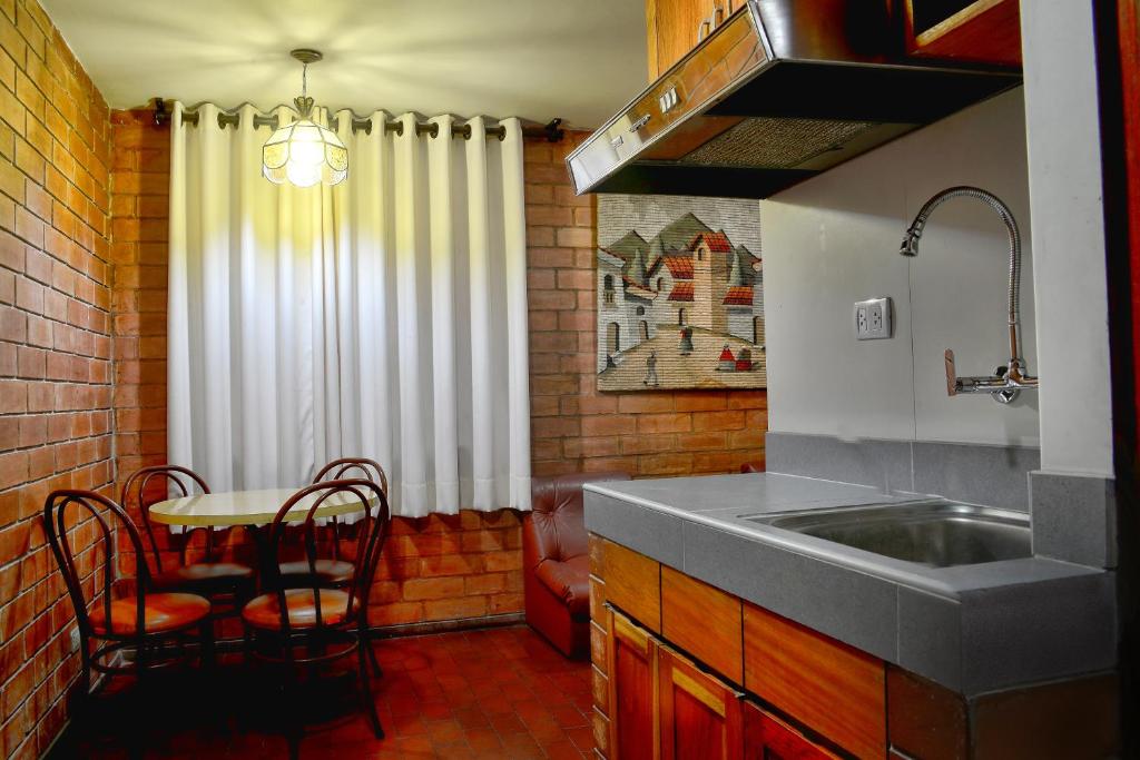 Kuchyň nebo kuchyňský kout v ubytování Hotel Esperanza