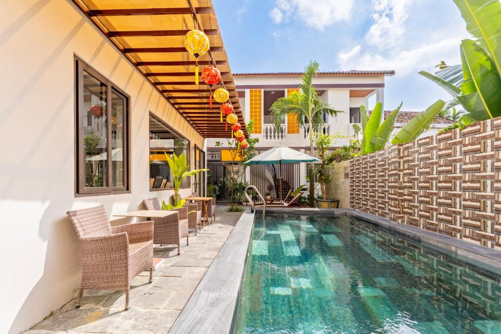 an image of a villa with a swimming pool at Laughter Garden villas in Tân Thành (1)