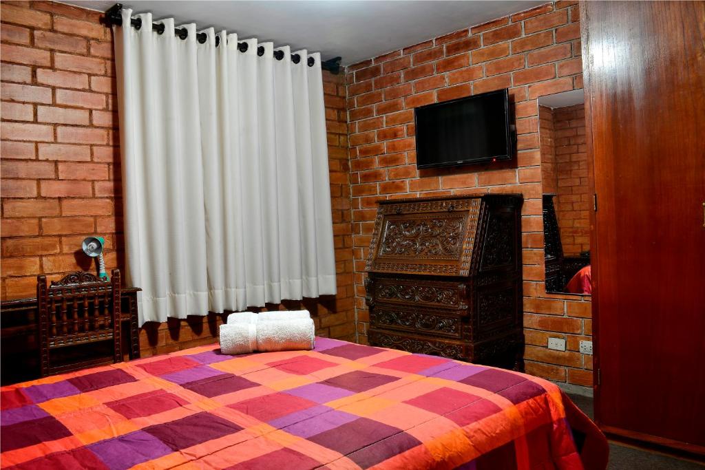 Postel nebo postele na pokoji v ubytování Hotel Esperanza
