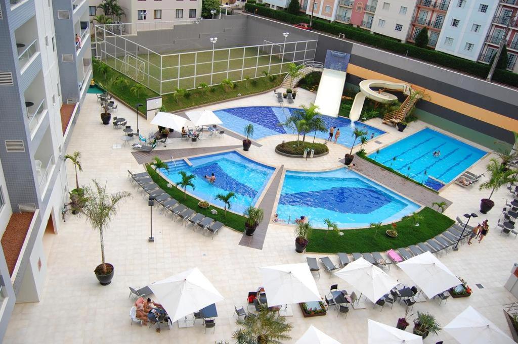 an overhead view of two swimming pools in a building at Veredas do Rio Quente 215 in Rio Quente