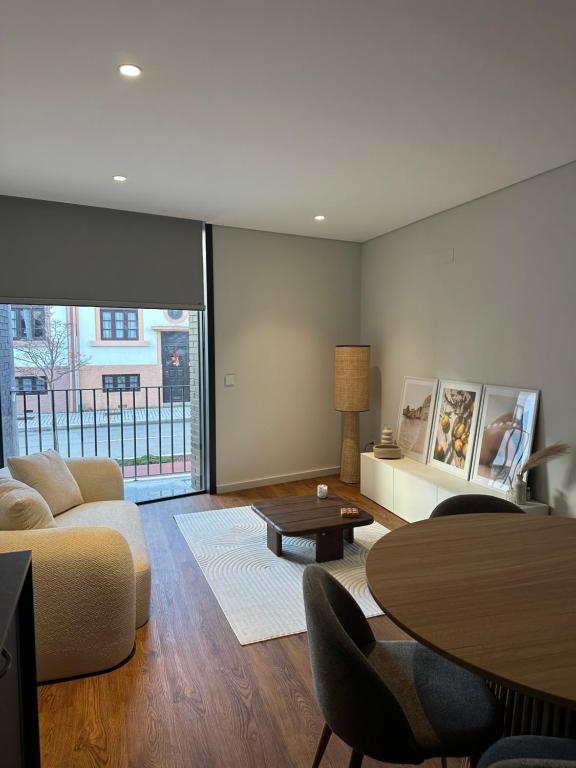 a living room with a couch and a table at Premium T1 - Sea & Coast in Espinho