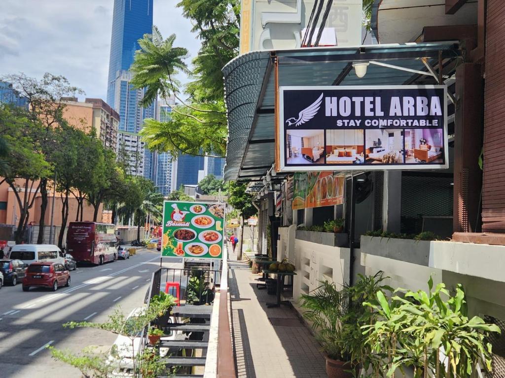 a street with a sign that reads hotel america stay competitive at Hotel Arba in Kuala Lumpur
