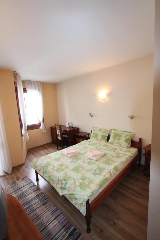 Postel nebo postele na pokoji v ubytování Guest House Ilinden