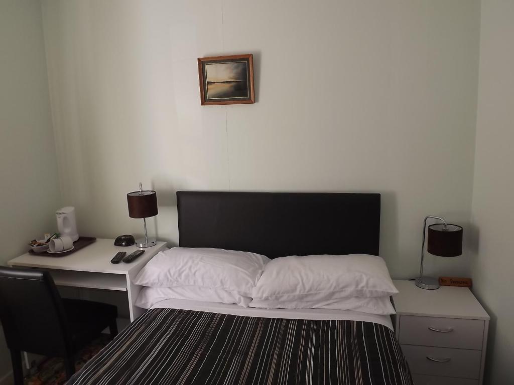 Postel nebo postele na pokoji v ubytování Glenavon Homestay
