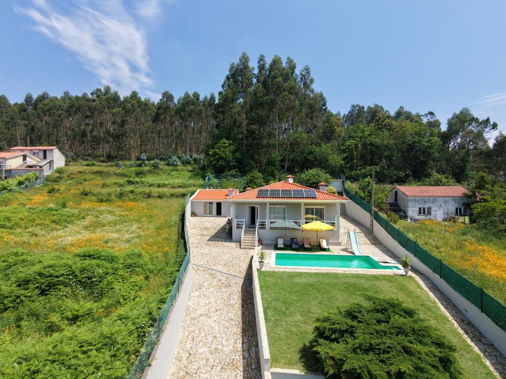 an aerial view of a house with a swimming pool at Casal do Porto - Um refugio de férias in Vila Verde