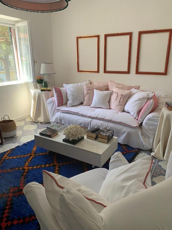 a living room with a couch and a coffee table at CasaFiumicello in Maratea