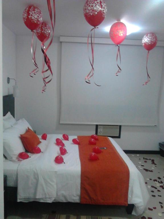 Postel nebo postele na pokoji v ubytování Hotel Pinares Plaza