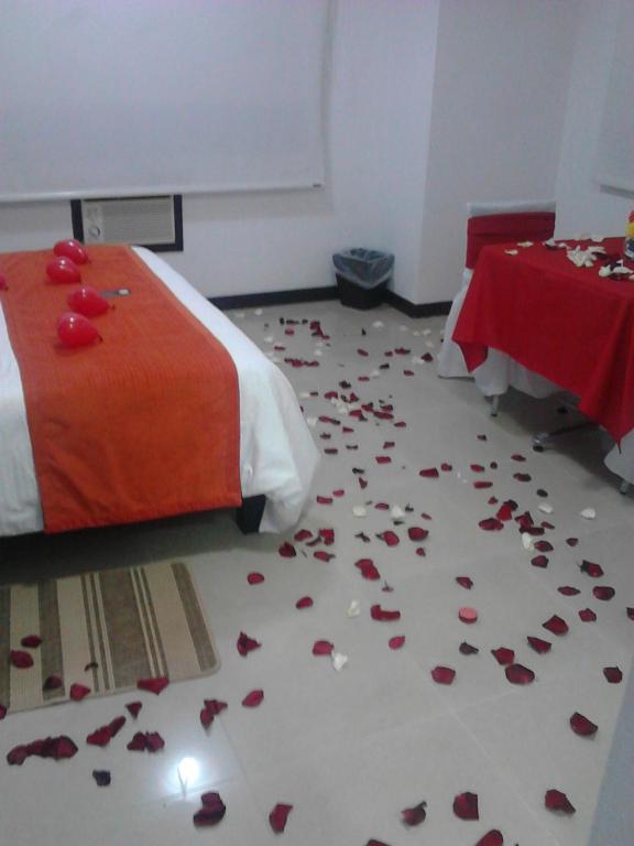 Postel nebo postele na pokoji v ubytování Hotel Pinares Plaza