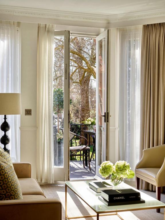 a living room with a couch and a coffee table at Collingham Serviced Apartments in London