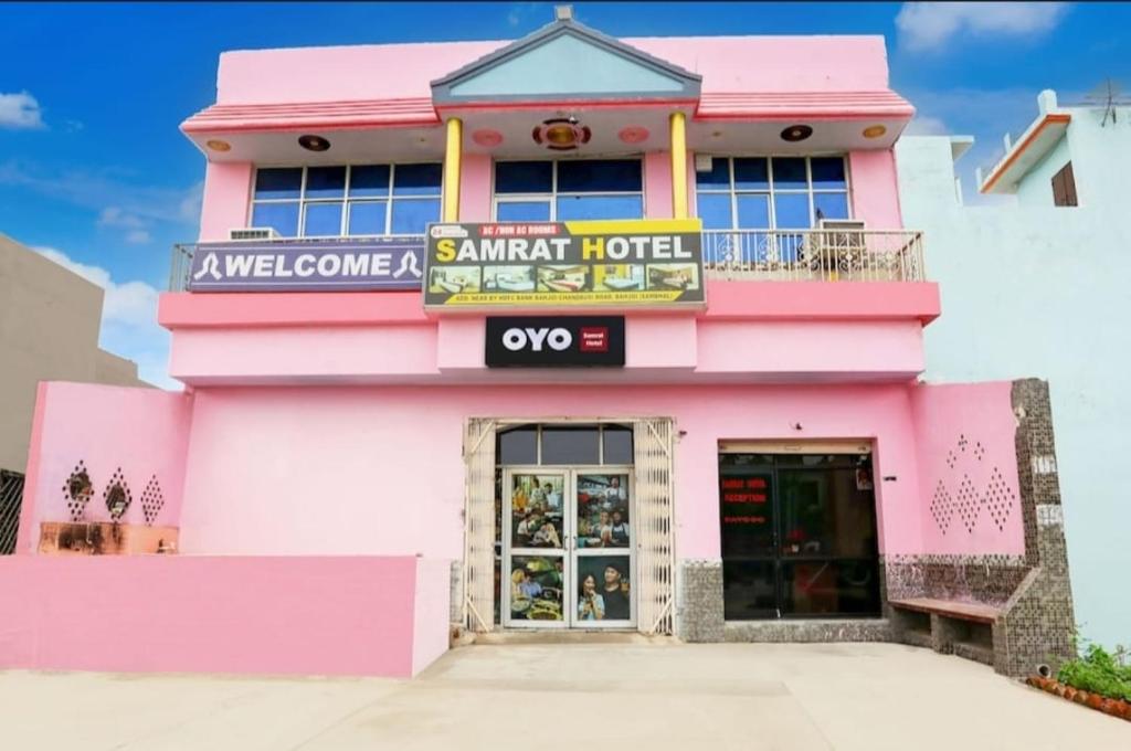 a pink building with a sign that reads ayoya camel hotel at Samrat Hotel in Sambhal