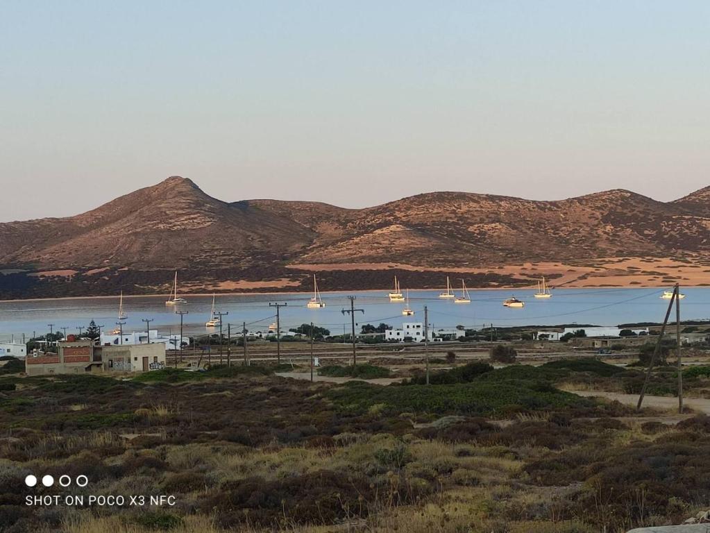 a view of a body of water with mountains in the background at Cycladic residence, Saint George, Antiparos in Agios Georgios
