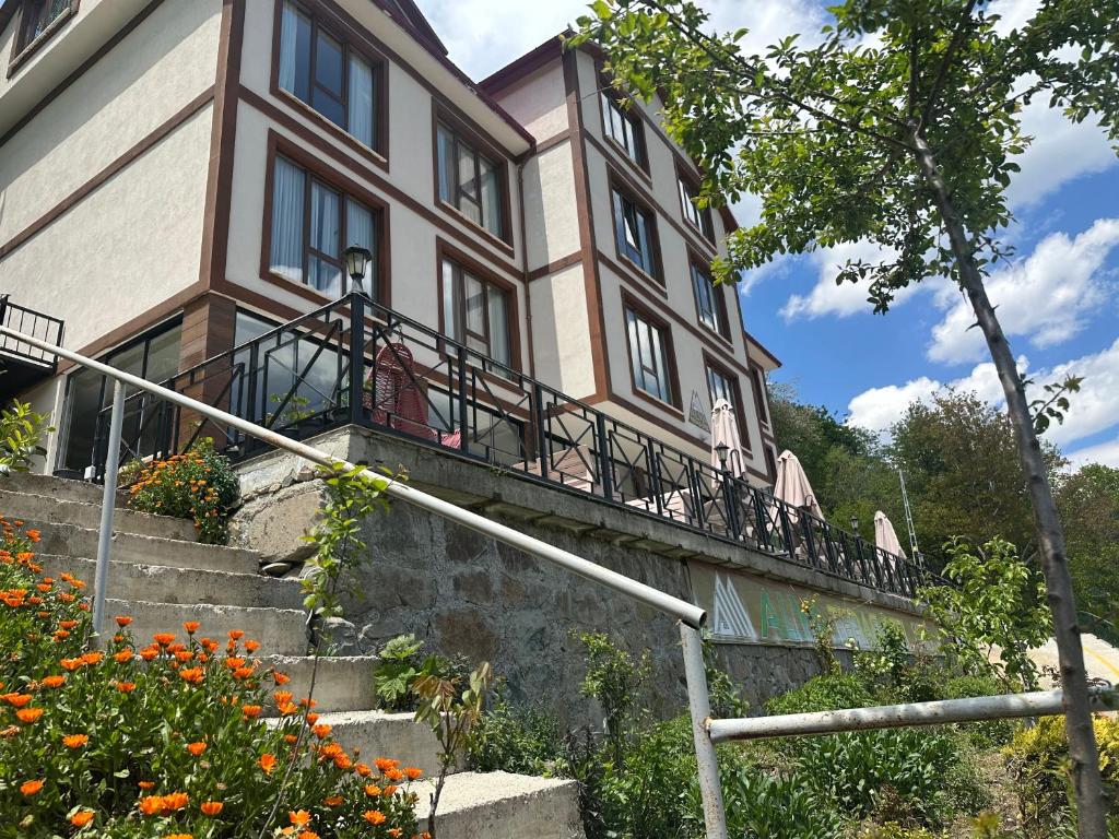 a building with a balcony on the side of it at Alya Teras Otel in Trabzon