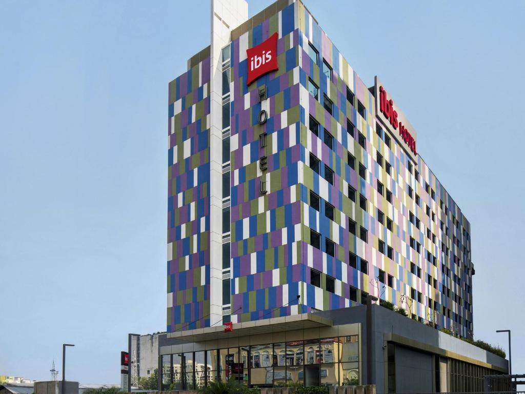a building with a hotel sign on top of it at ibis Kolkata Rajarhat - An Accor Brand in Kolkata