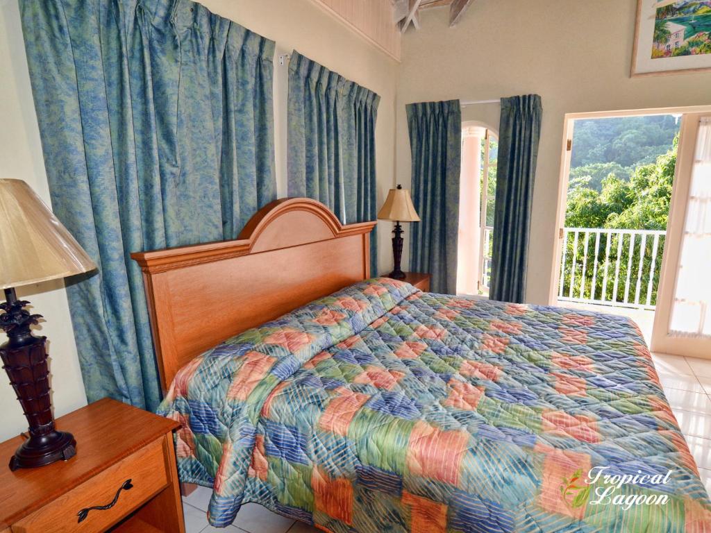 Letto o letti in una camera di Tropical Lagoon Resort