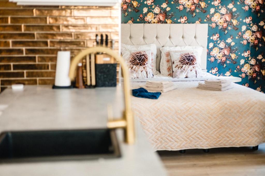 a bedroom with a bed with pillows on it at bijDorien in Gennep