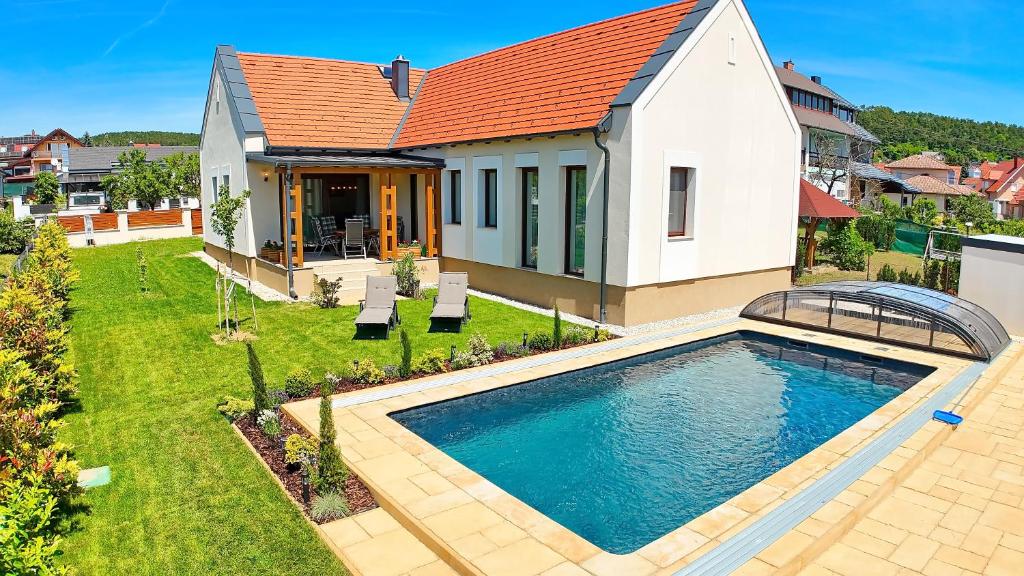 an aerial view of a house with a swimming pool at no 117 Villa Balantis in Vonyarcvashegy