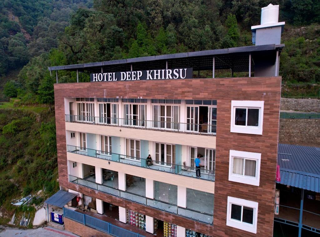 a hotel deep kithilaji with people on the balcony at Hotel Deep Khirsu in Malaī