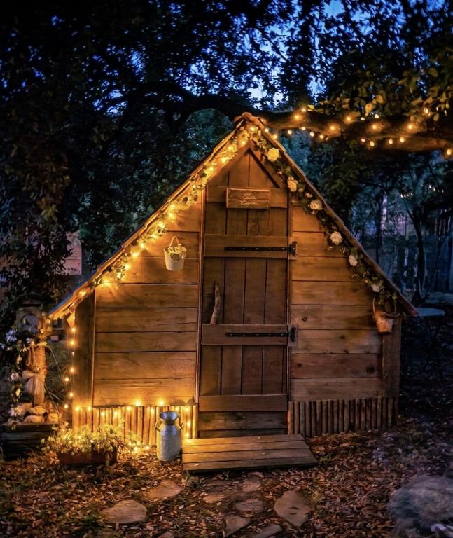 a small cabin with lights on it at night at Nuit insolite et féerique tout près d'Ajaccio in Alata