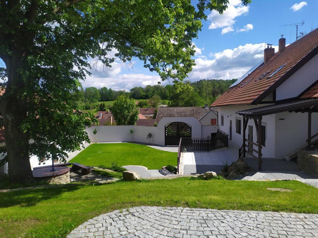 a view of a yard with a house at Statek Český Dvůr in Postupice