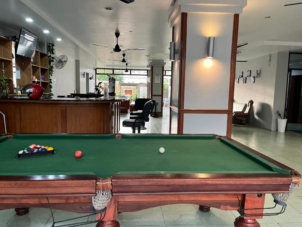 a pool table in the middle of a room at Emerald hotel in Jomtien Beach
