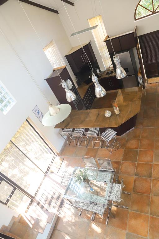 an overhead view of a living room with a table and chairs at Selah Sands in Port Alfred
