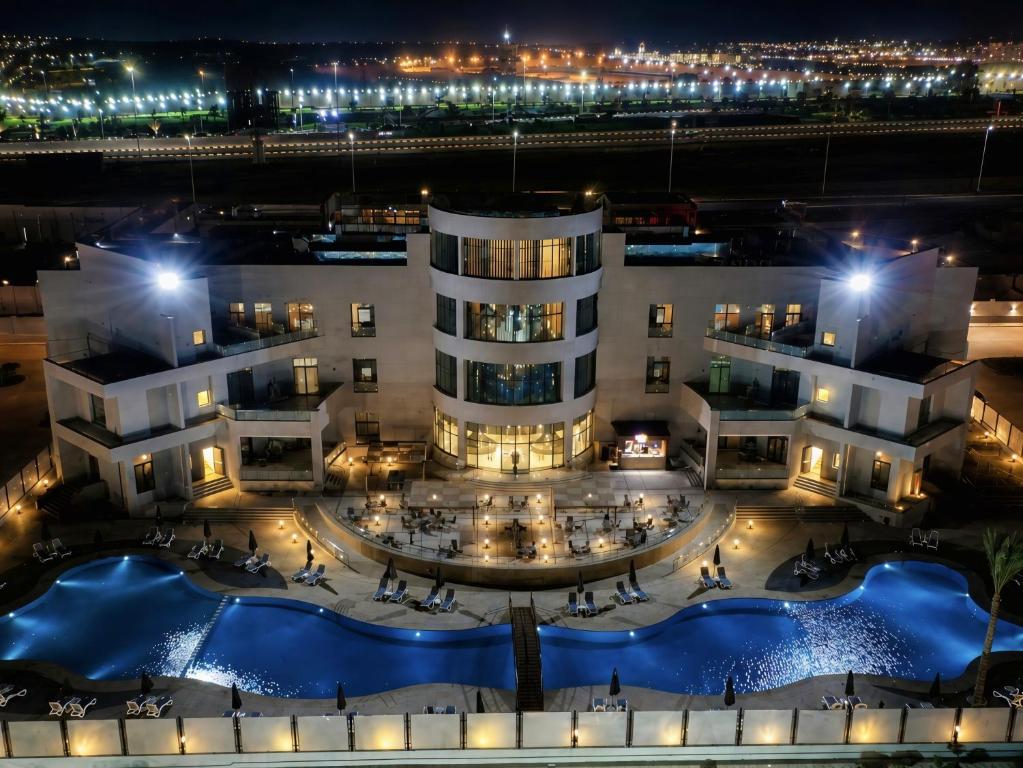 an aerial view of a hotel at night at Jewel Plaza and Aqua Park in Cairo
