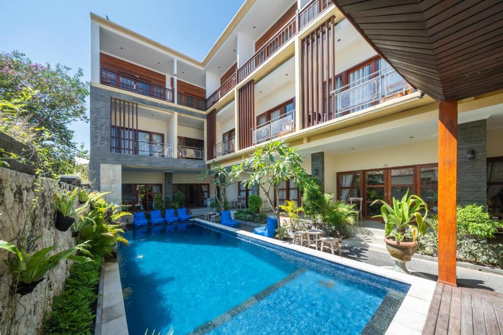 an exterior view of a villa with a swimming pool at The Pulau Bungalow in Nusa Lembongan