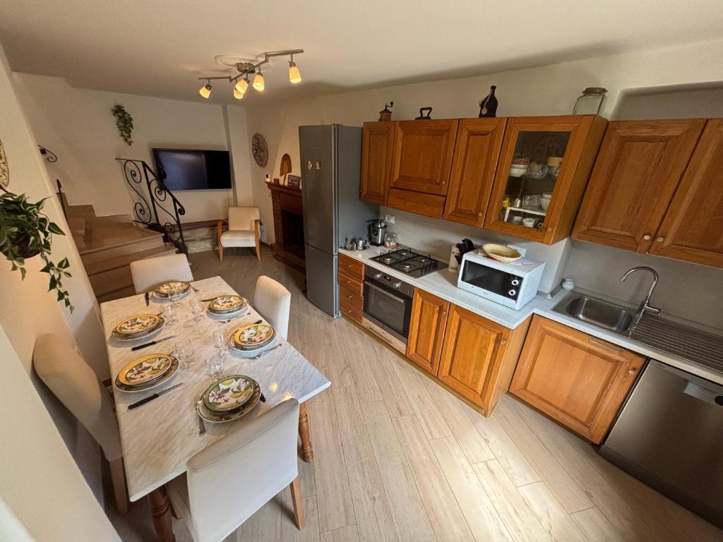 a kitchen with a table with plates of food on it at Vicolo dell'Orto in Montaione