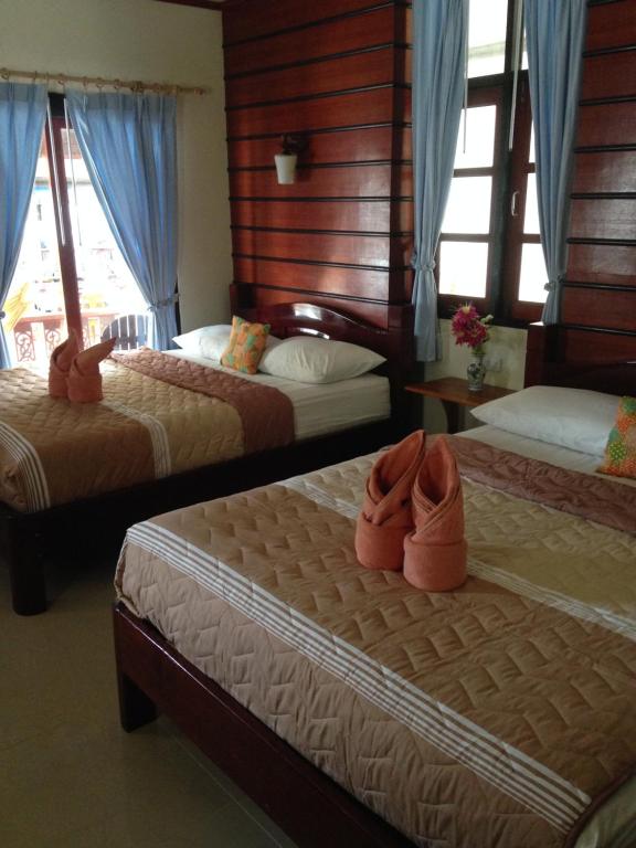 Postel nebo postele na pokoji v ubytování Starlight Haadrin Resort