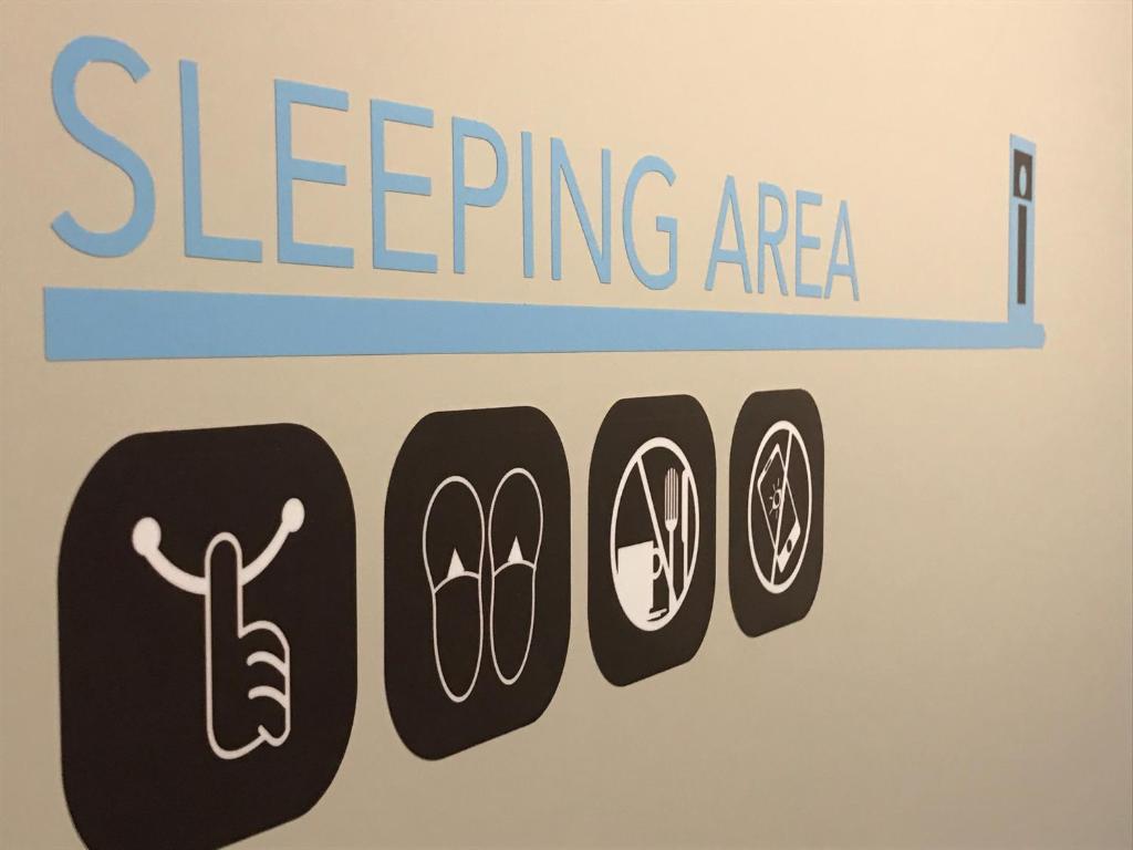 a sign for a sleeping area with the words sleepping area at Single Inn - Taipei in Taipei