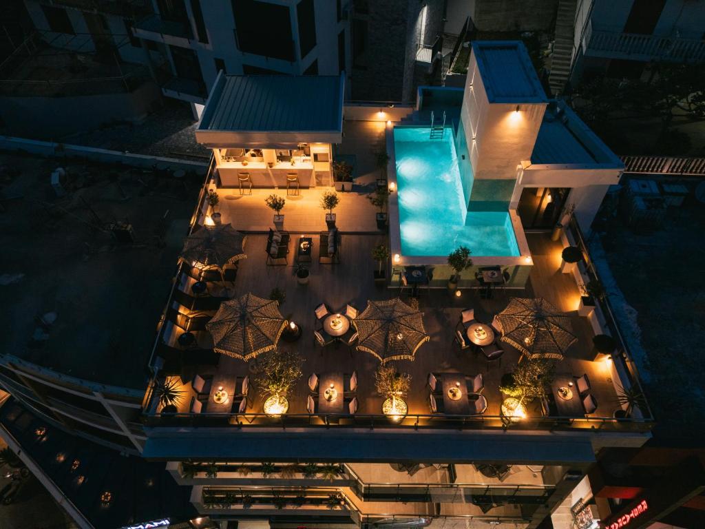an aerial view of a hotel with a pool at night at Atelier in Ulcinj