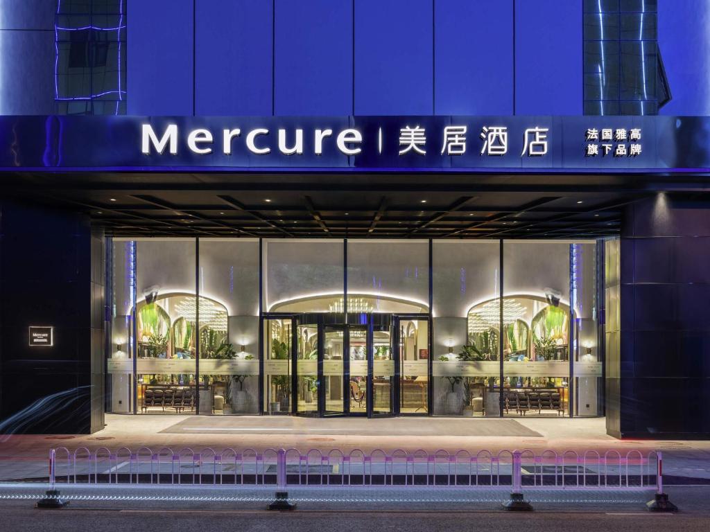 a store front of a store with a sign on it at Mercure Nanjing Downtown in Nanjing