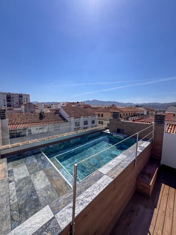 a swimming pool on the roof of a building at Amaranta Hotel Boutique in Ronda