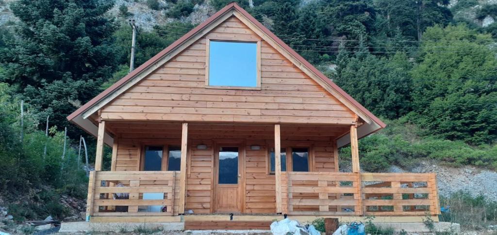 a log cabin with a window on top of it at The Sam's house in Panouryiás