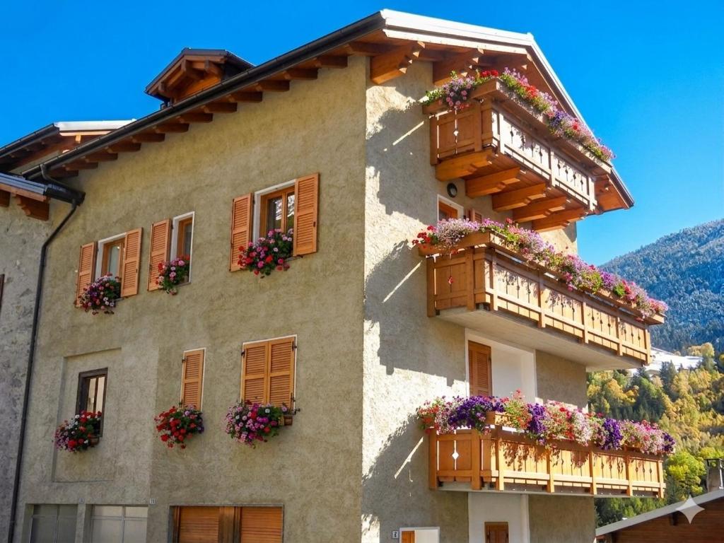 a building with flower boxes and balconies on it at Casa Elda in Valdidentro