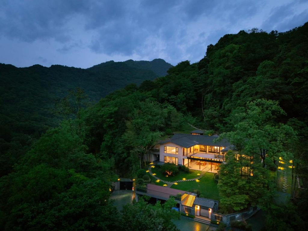 an aerial view of a house in the mountains at Qingcheng Mountain Wujing Mountain Residence in Dujiangyan