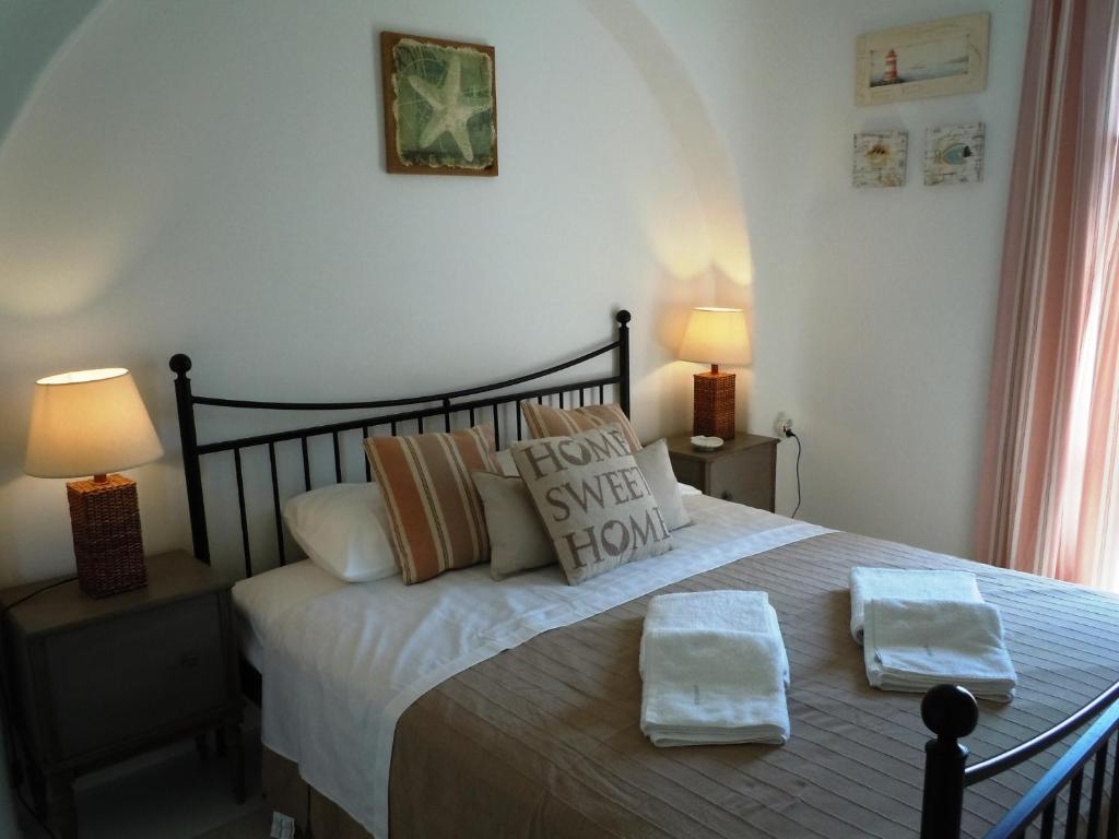 A bed or beds in a room at Anthos House
