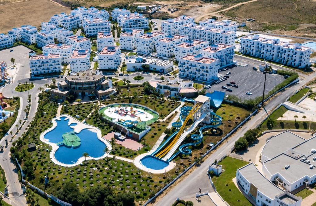 an aerial view of an apartment complex with a water park at Marina smir Oceanica Apartments in Marina Smir