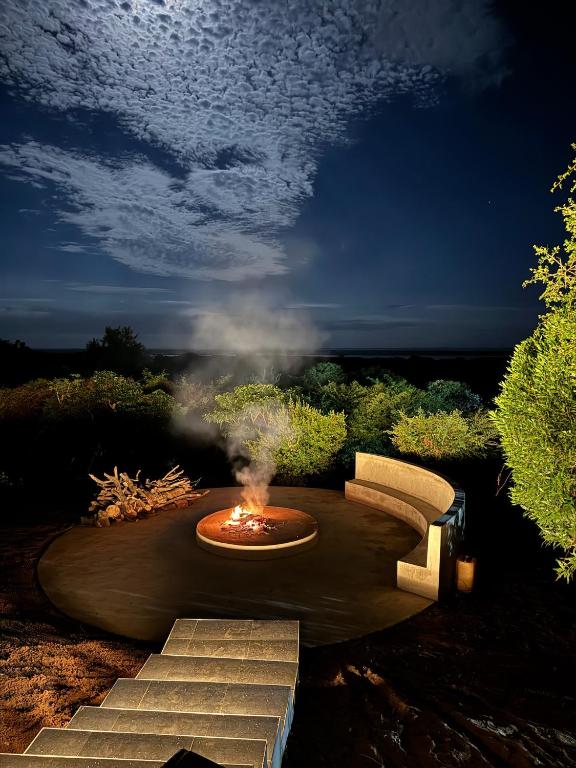 a fire pit in the middle of a yard at First Light Serenity in Hluhluwe