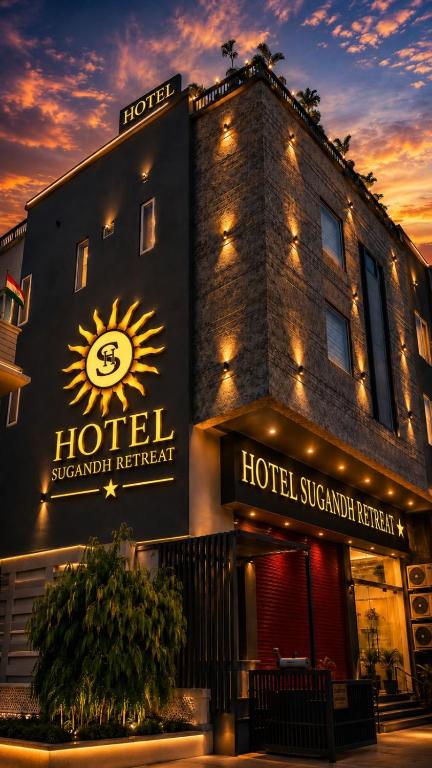a hotel with a sign on the side of it at Hotel Sugandh Retreat Near Bus Stand Jaipur in Jaipur