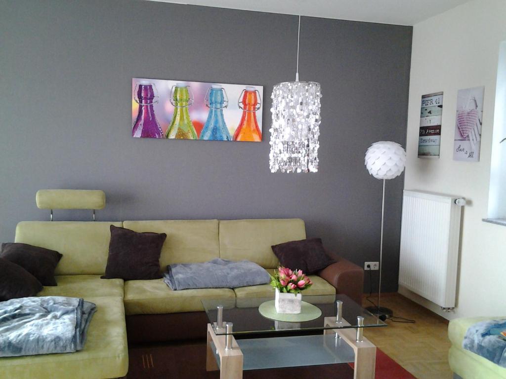 a living room with a couch and a table at Ferienwohnung Keull in Coesfeld
