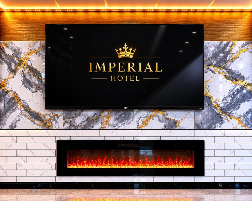 a sign for an imperial hotel above a fireplace at Imperial Hotel Brooklyn New in Brooklyn