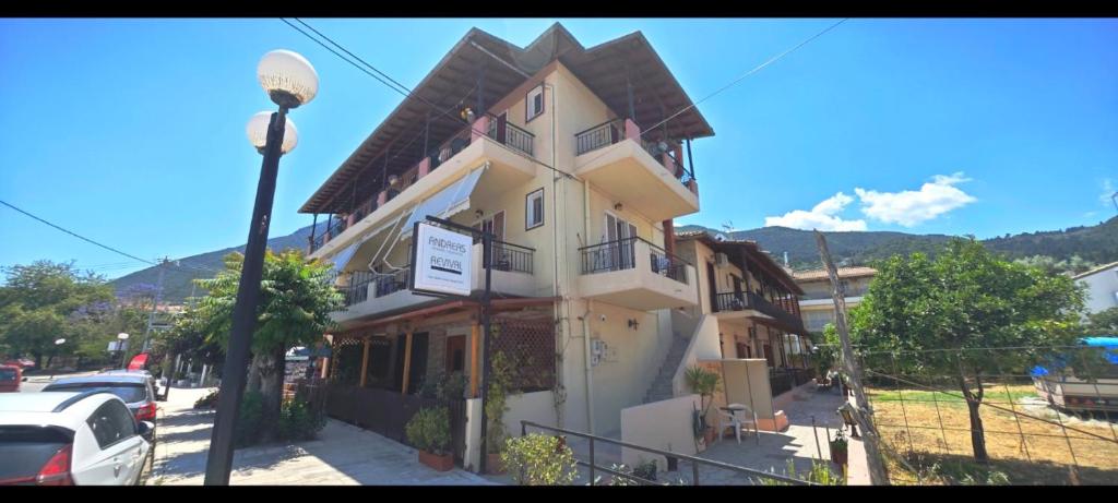 a building on the side of a street at Haras rooms in Nikiana
