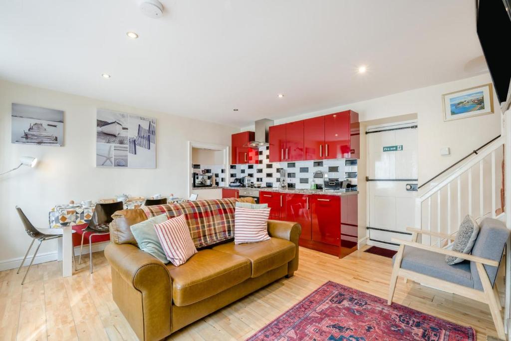 a living room with a couch and a kitchen at 2 Bed in Cromer oc-2309 in Cromer