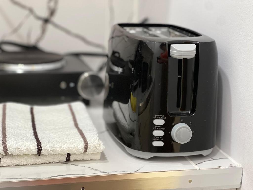 a toaster sitting on a counter next to a towel at Appartement 1 - OUEST in Rimouski
