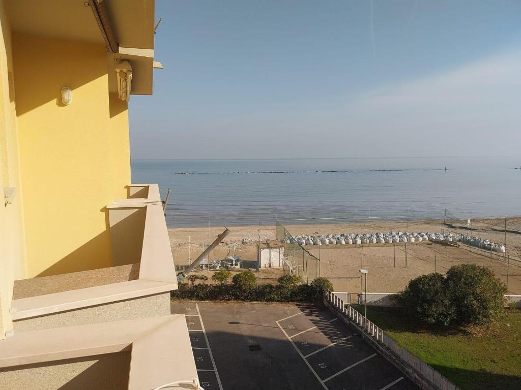a view of the beach from a balcony of a building at LaSpiaggia21 in Marotta