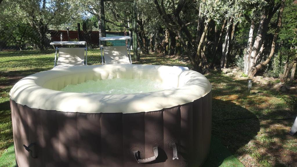 a large hot tub in a yard with trees at La Teodolinda in Arezzo